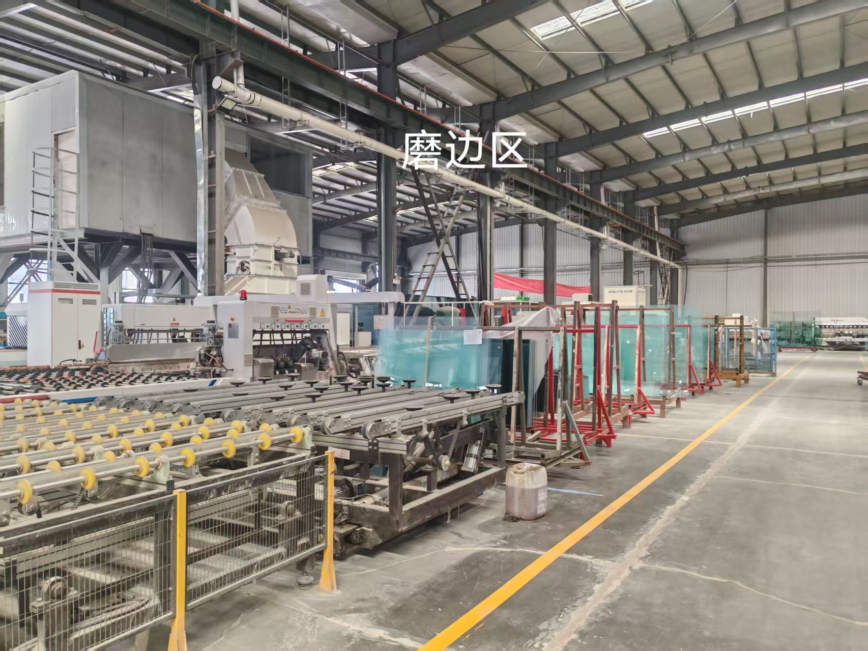 Glass edge processing area with production equipment and racks