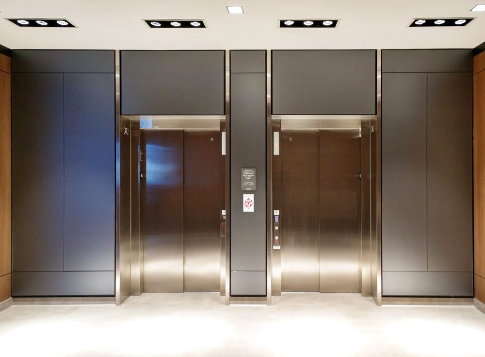 Precision etched wall panels in a contemporary hotel elevator lobby