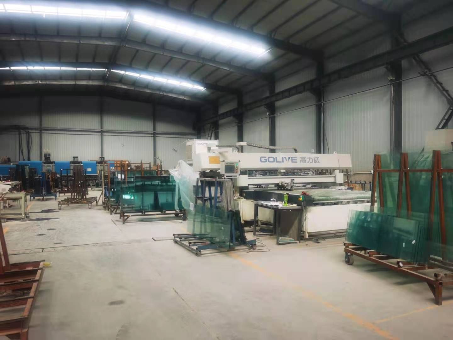 Architectural glass processing equipment on the factory floor