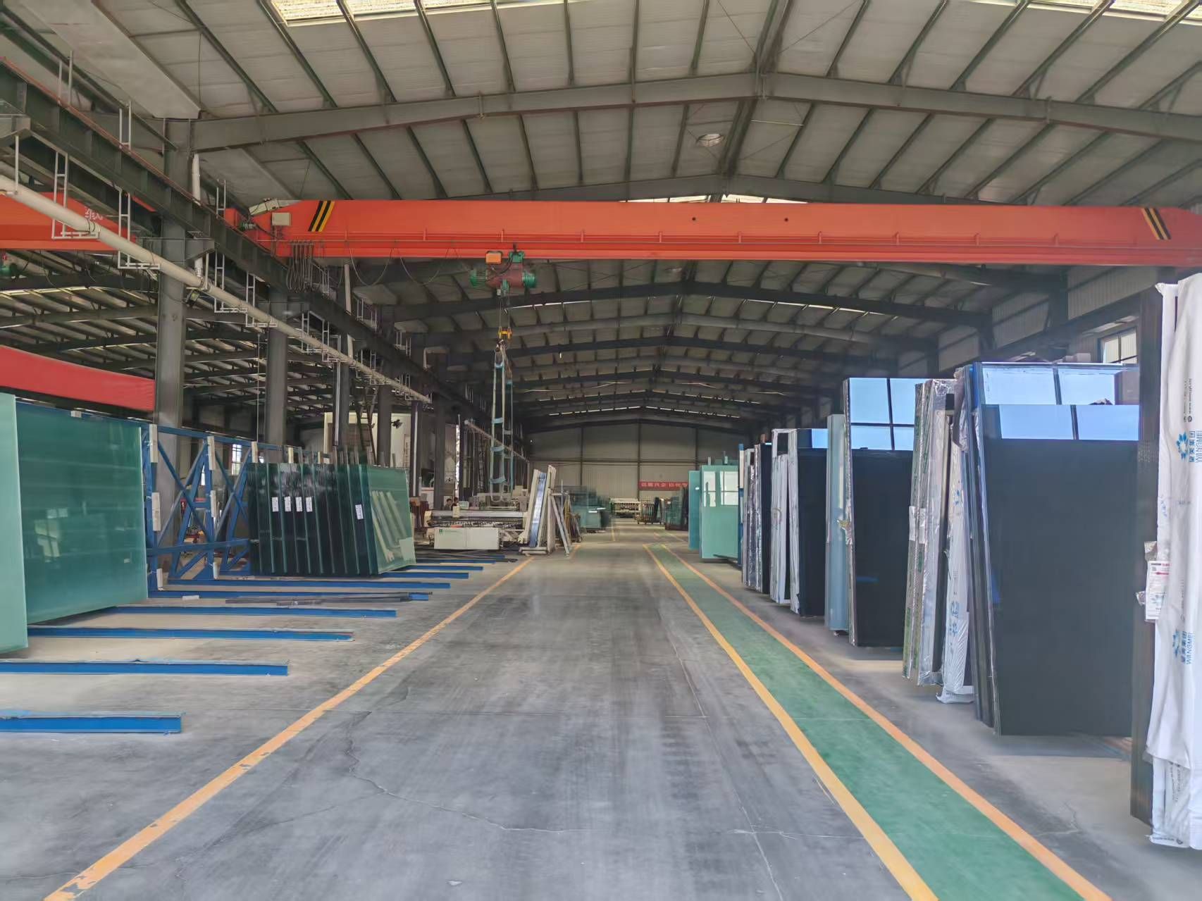 Main production aisle inside the WJ architectural glass factory