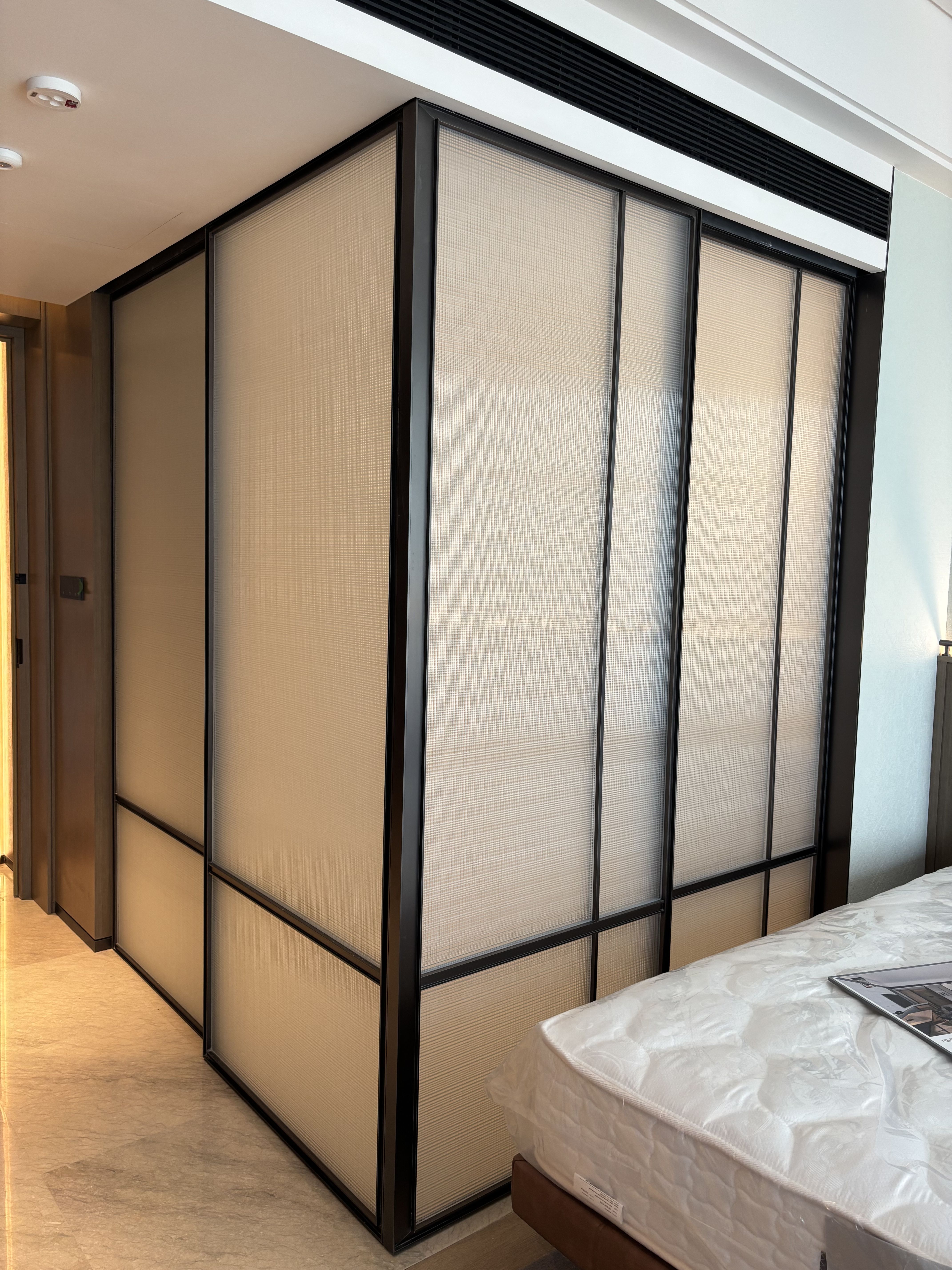 Decorative art glass screen in a hospitality interior