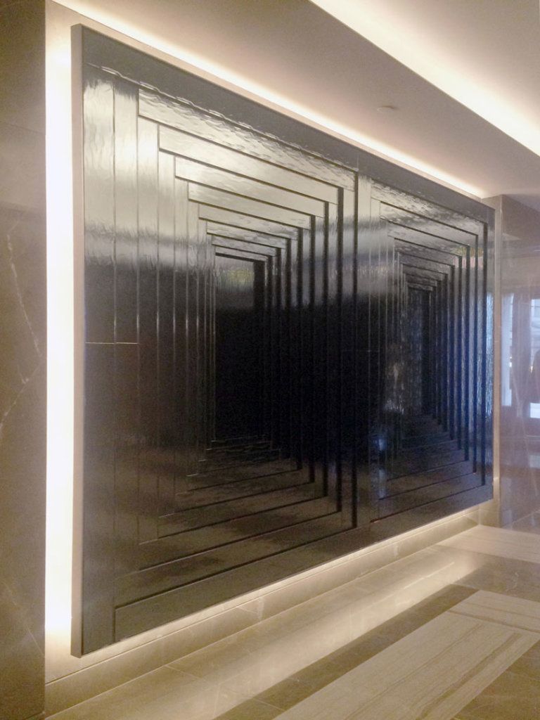 Decorative mirror feature wall in an upscale hospitality interior