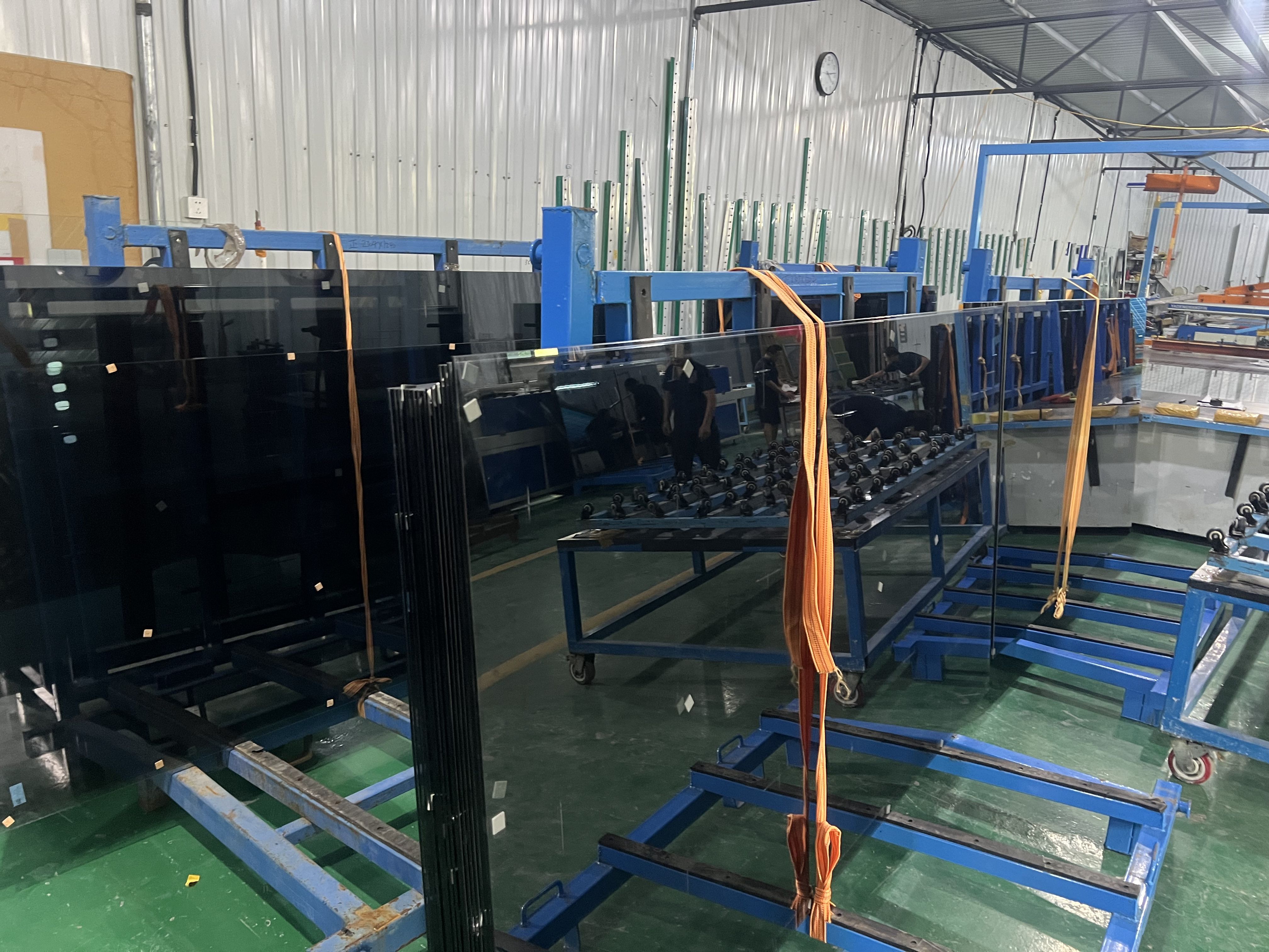 Architectural glass organized on production racks
