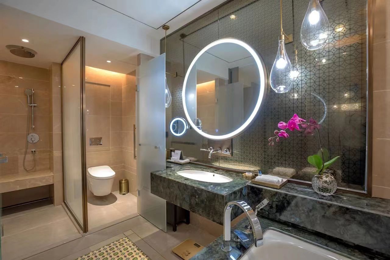 Hotel bathroom vanity and glass enclosure at Pan Pacific Yangon